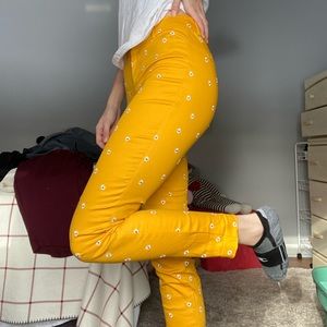 Yellow dress pants with white flower stitching
